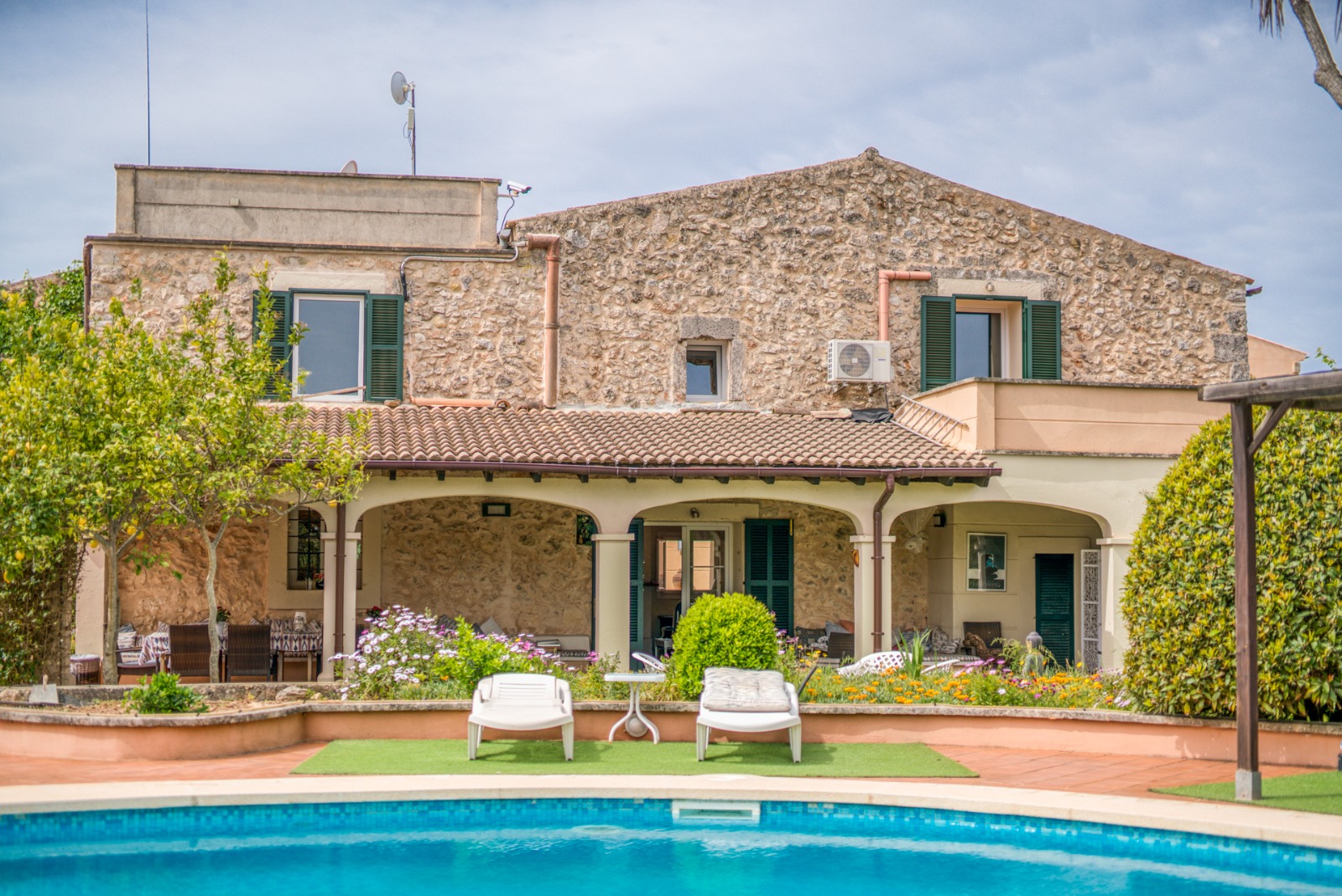 Traditional natural stone finca by Santa Margalida with lovingly landscaped garden and poo