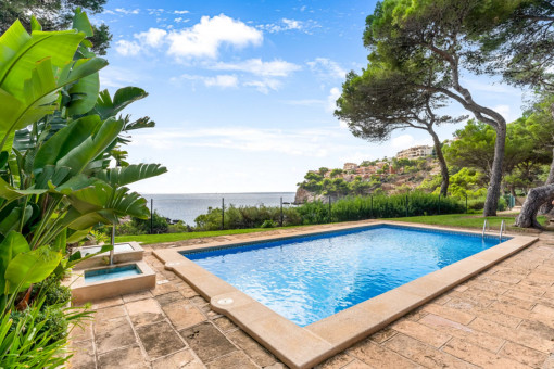 Community pool with sea views