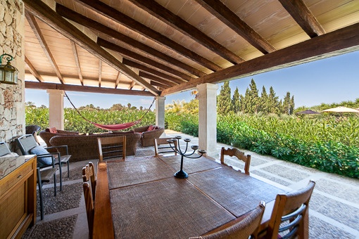 Covered terrace with garden views