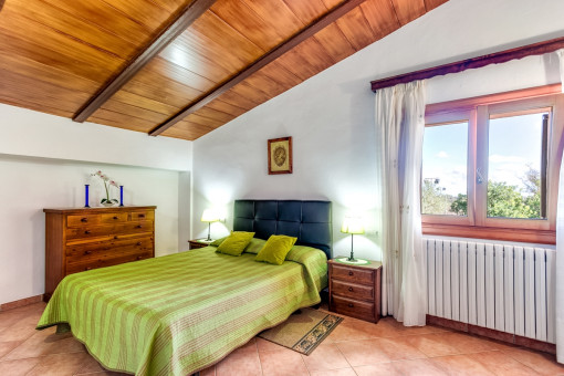 Beautiful bedroom with wooden ceiling