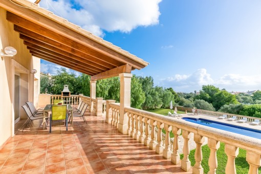 Large terrace with garden and pool views