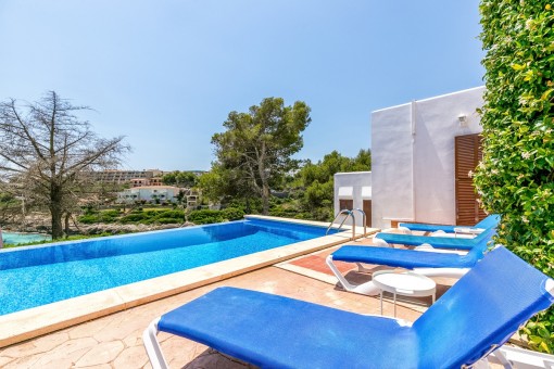 Sunny pool area with sea views