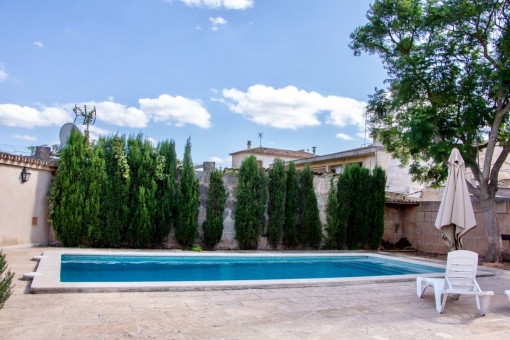 Spacious pool area with sunbeds