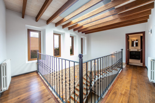 Upper floor with wooden ceiling beams