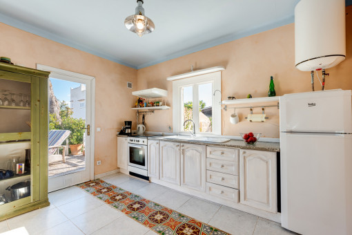 Bright kitchen with terrace access