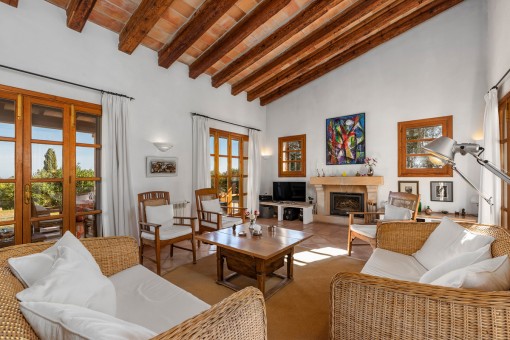 Living area with fireplace and wooden ceiling beams