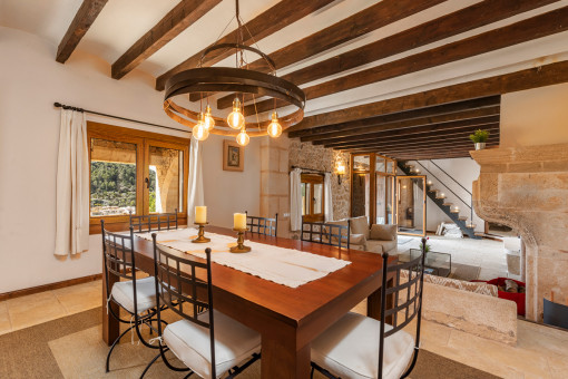 Dining area with wooden ceiling beams