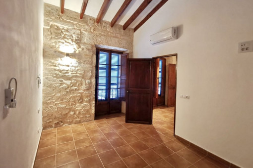 Bedroom with natural stone wall