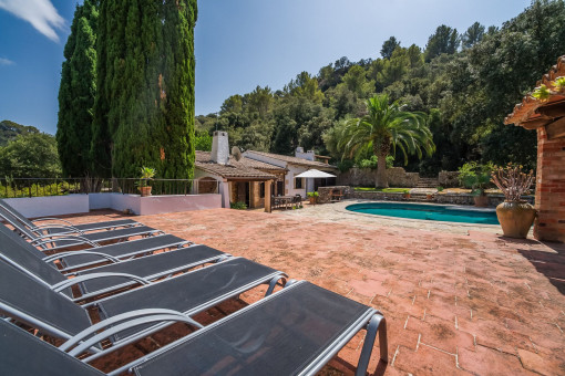 Large pool area with sun loungers