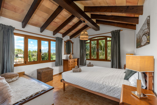 Cosy bedroom with wooden beams