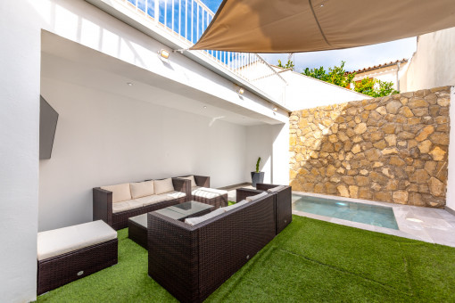 Private courtyard with outdoor dining area and pool