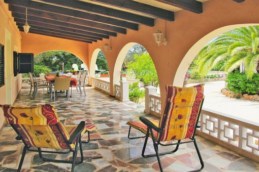 Covered terrace with garden views