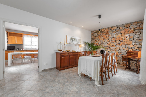 Dining area with natural stone wall