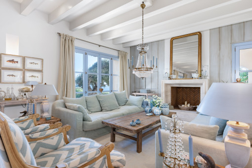 Living area with fireplace and sea views